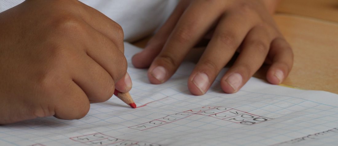 Hands drawing a plan